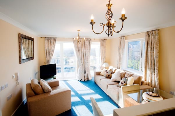 Spacious living room with natural light and comfortable seating