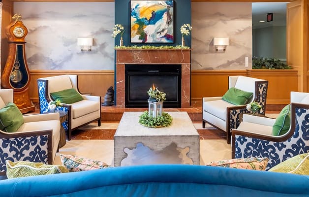 Comfortable lounge seating with a fireplace.