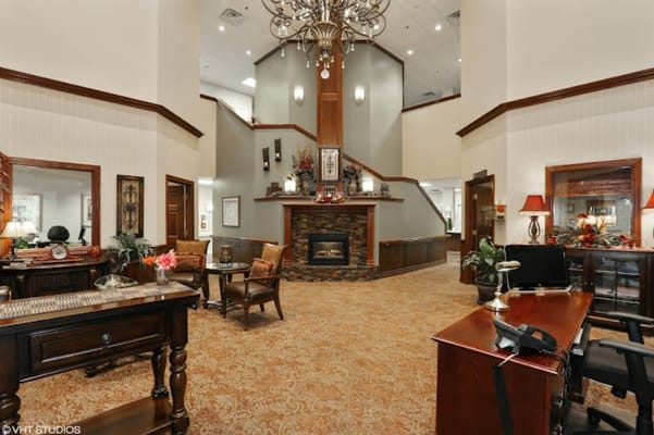 Common area of a senior living facility with a fireplace