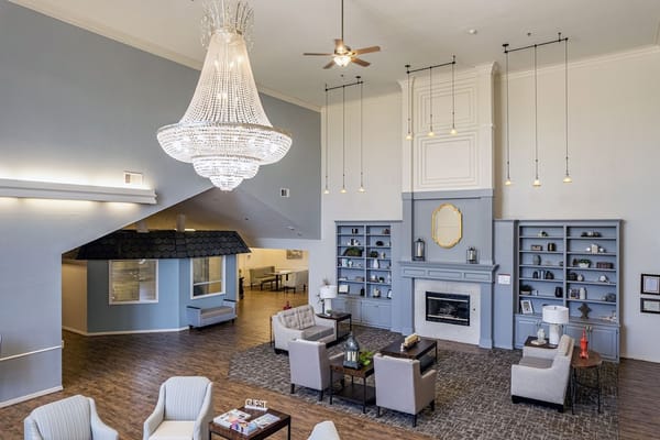 Elegant lobby with chandelier and comfortable seating.