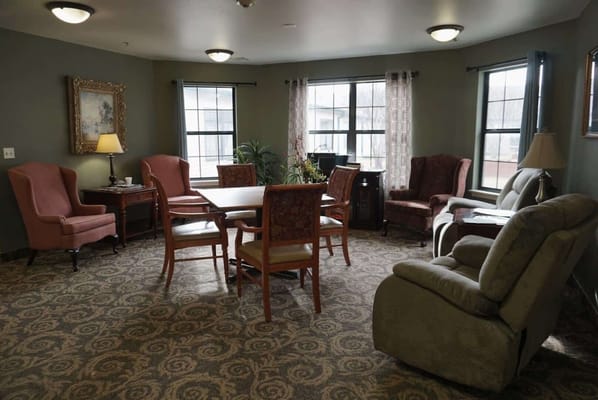 Spacious living room with seating and natural light