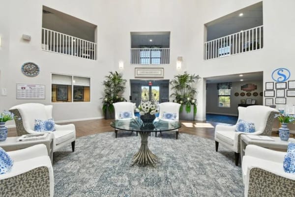 Spacious lobby with seating and decorative plants