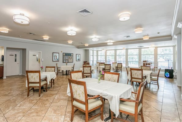 Spacious dining area with tables set for meals