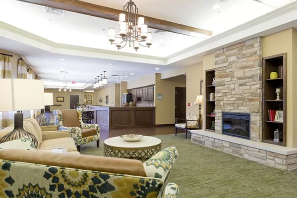 Cozy lounge area with comfortable seating and a fireplace