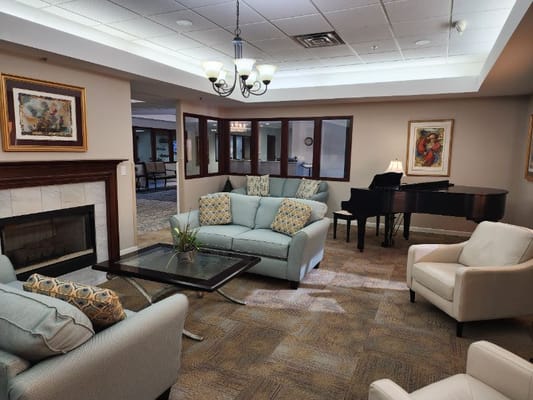 Cozy common area with seating and a piano