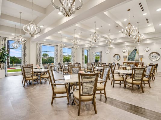 Stylish dining area with chandeliers and tables at SoCo Village