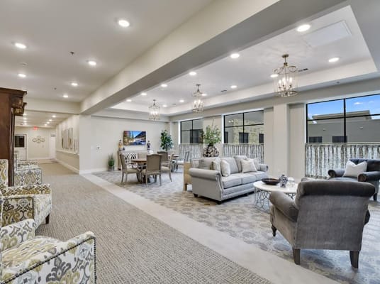 Spacious common area with seating and dining options