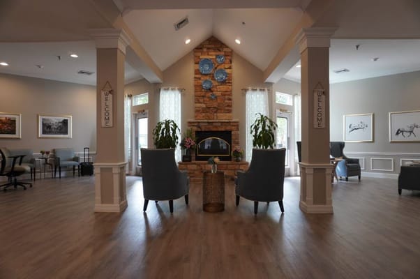 Welcoming lobby with seating and decorative fireplace