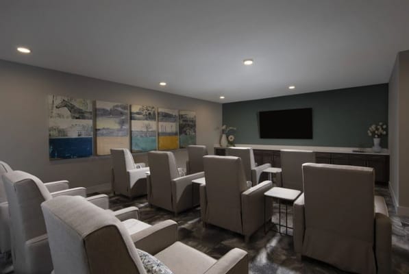 Cozy lounge area with seating and artwork