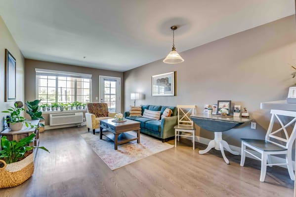 Bright common area with comfortable seating and decor