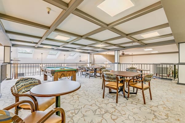 Game room with pool table and seating area