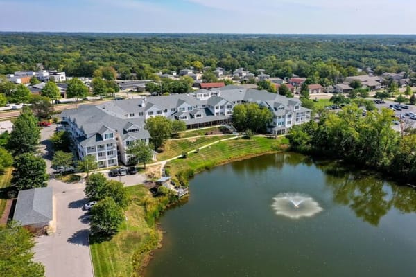 Aerial view of Solstice Senior Living at Columbia showing the building and pond