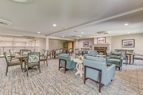 Common area with seating and tables in a cozy setting