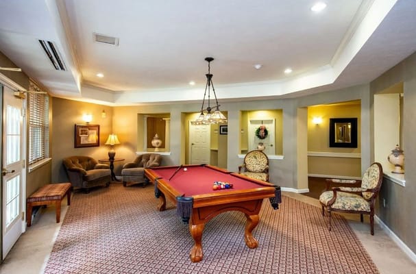 A pool table in a lounge area with seating at SouthWest Commons.