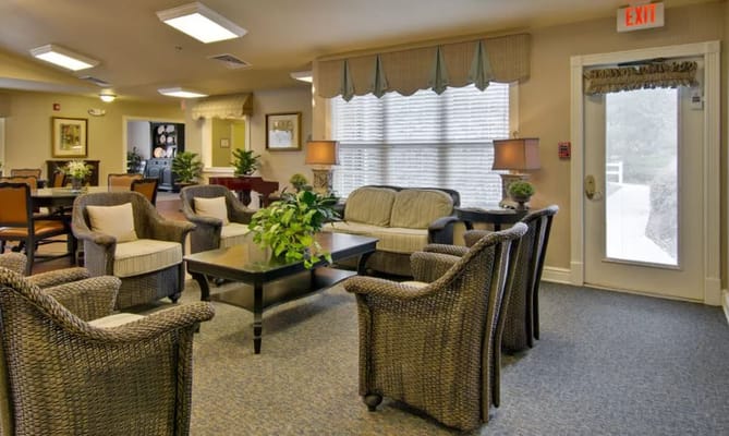 Cozy seating area with wicker chairs and a coffee table.