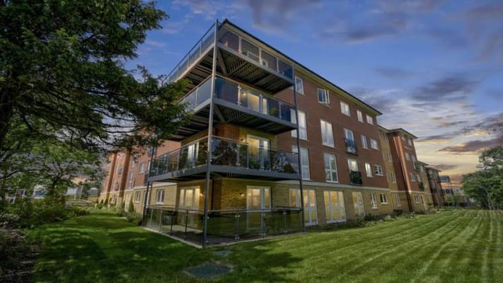 Exterior view of Spitfire Lodge at sunset