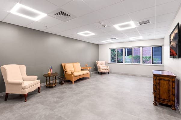 Cozy lounge area with chairs and a wooden table