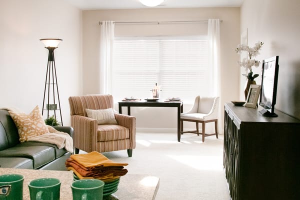 Cozy living room with comfortable seating and dining area.