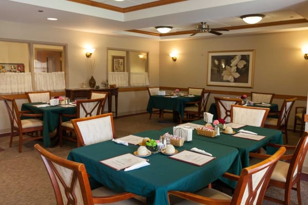 Dining area with set tables and decor