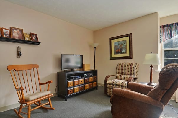Comfortable living room with a rocking chair and side table