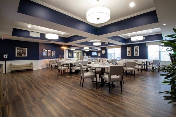 Well-lit dining area with tables and chairs in StoryPoint Fairfield