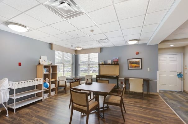 Bright community room with tables and chairs