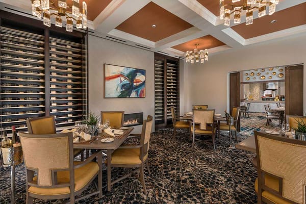 Interior of the dining room with elegant decor and wine display