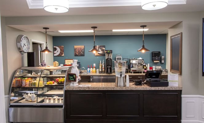 Interior view of the coffee bar with various drinks and snacks visible.