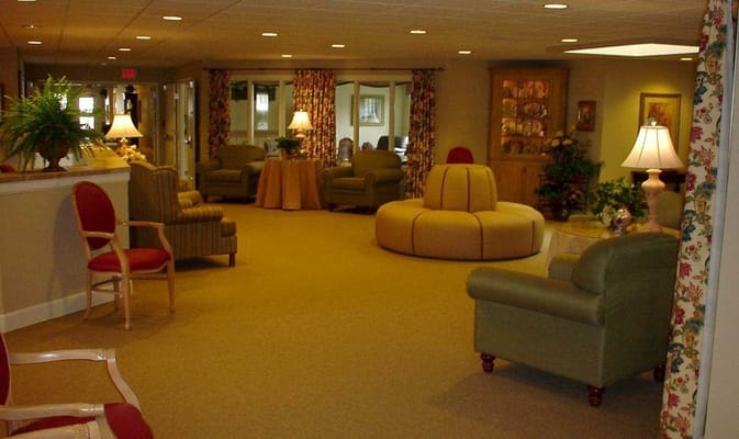 Spacious living room with comfortable seating and decorative lamps.