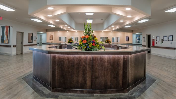 Reception area with floral arrangement at Sun Valley Rehabilitation and Healthcare Center