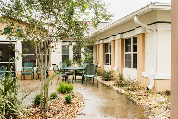 Outdoor courtyard with seating and greenery