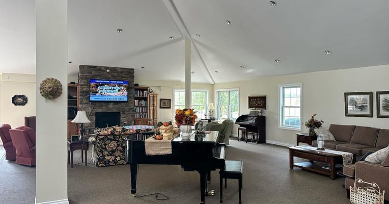 Cozy living room with piano and comfortable seating area