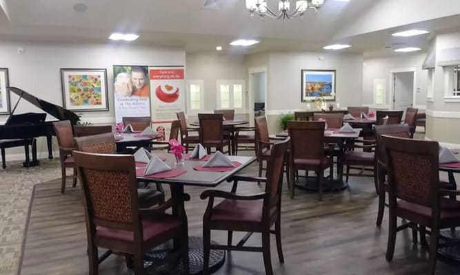 Interior of the dining room showing tables and piano