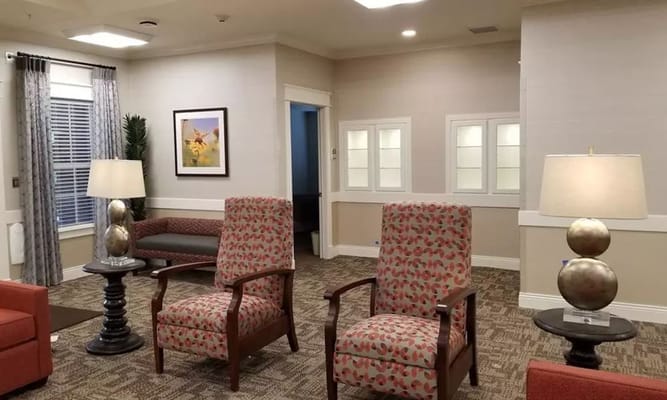 Comfortable chairs and table in a living room setting.
