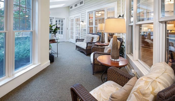 Cozy sunroom with seating and natural light
