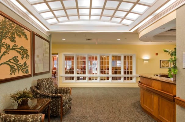 Lobby area with seating and large windows at The Cedars Portland