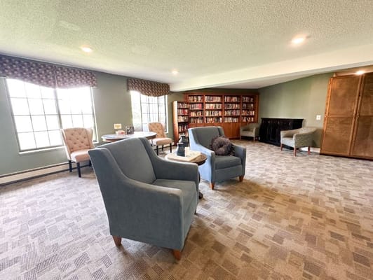 Interior view of a cozy reading area with bookshelves