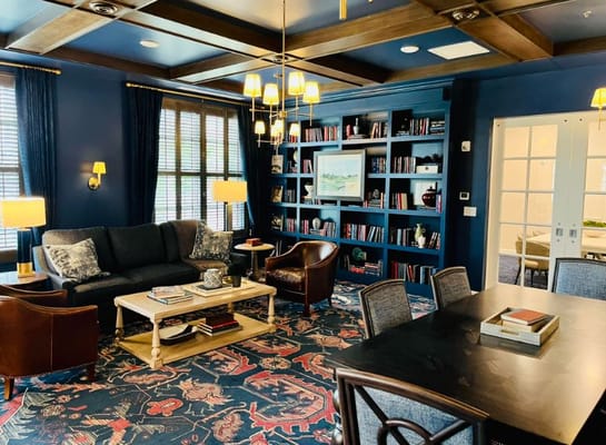 Cozy common area with seating and bookshelves