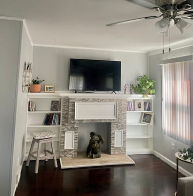 Cozy living room with a fireplace and plants