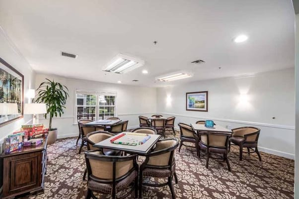 Cozy game room with tables and chairs