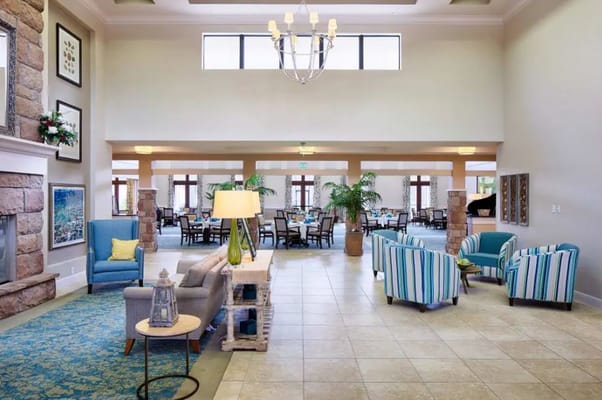 Bright common area with seating and dining space