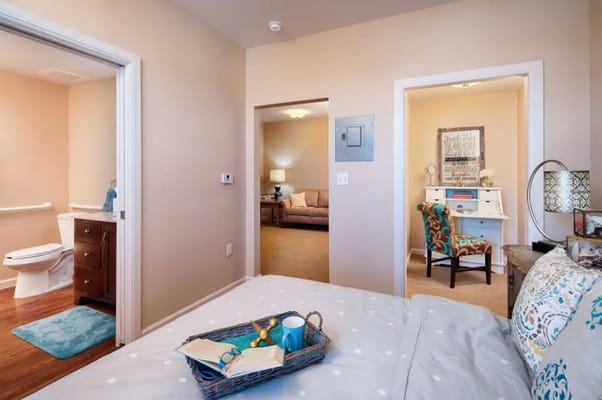 Cozy resident room with a bed and seating area