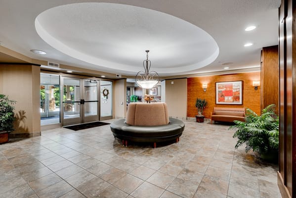 Cozy lobby area with seating and decorative plants