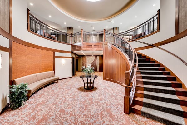 Interior view of the lobby featuring a staircase and seating area.