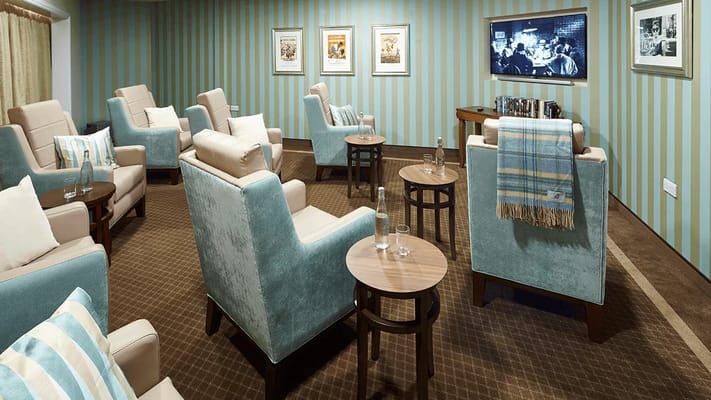 Lounge with comfortable seating and striped walls