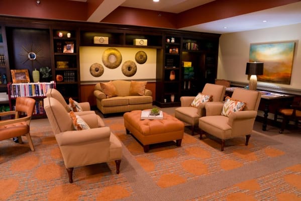 Comfortable living room with seating and bookshelves