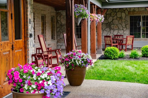 Colorful flower pots on a patio at The Inn at Library Way.