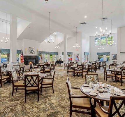 Spacious dining area with tables set for meals