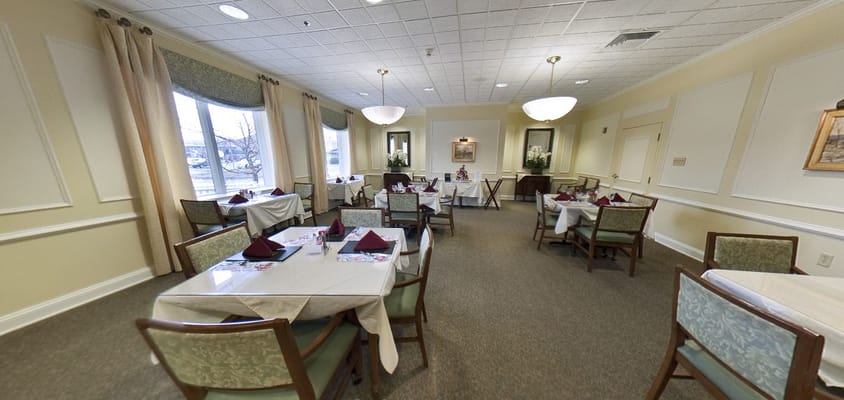 Interior dining room with tables set for meals