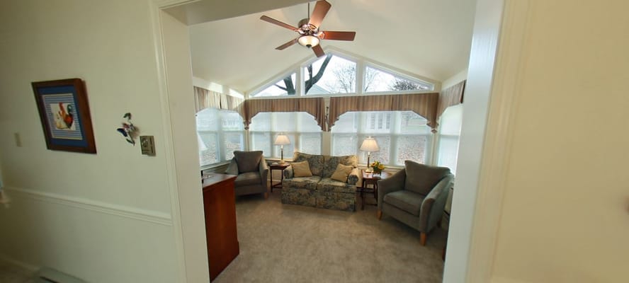 Bright common area with seating and natural light